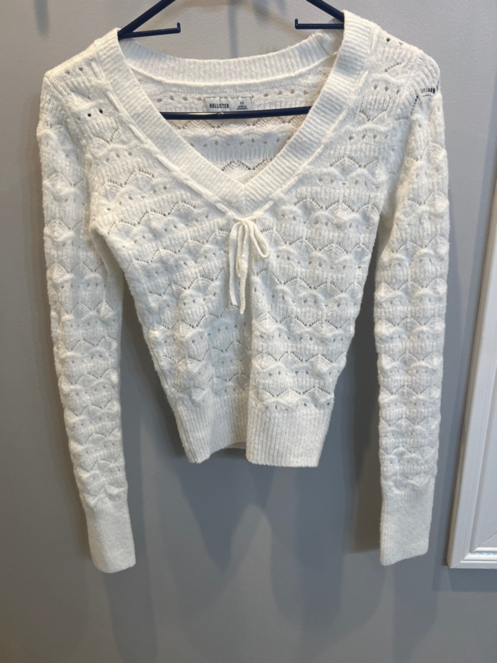 Hollister Cream V‑Neck Knit Sweater with Front Tie